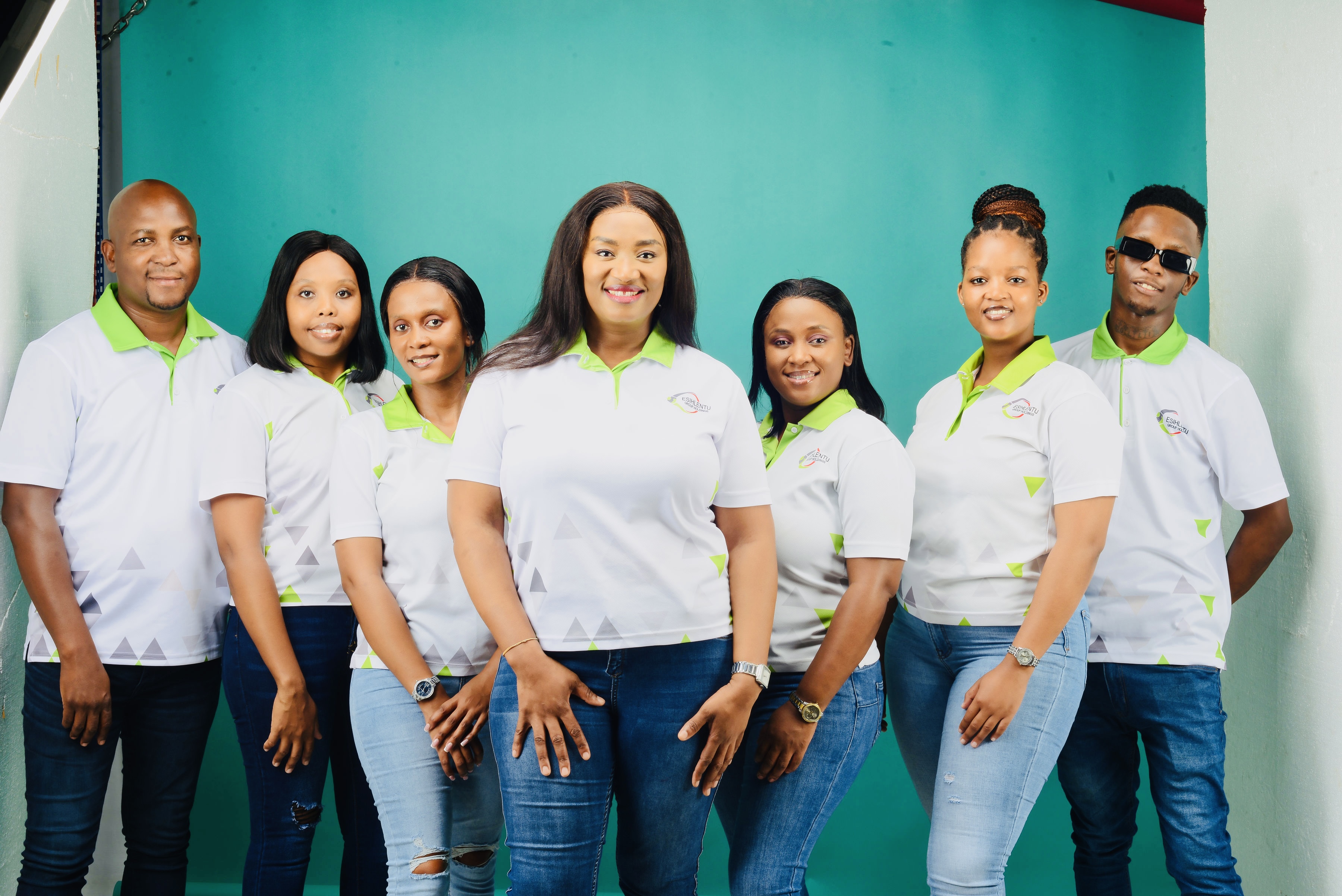 Esihlentu Group staff standing together in company uniform